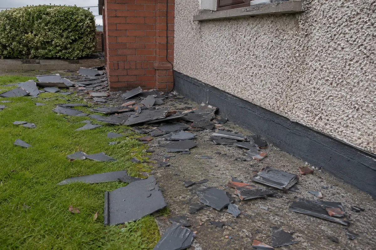 Slipped and missing slates across a Dublin roof slope after wind damage